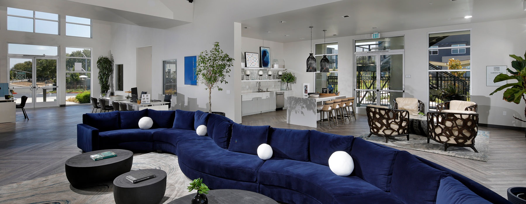 Spacious and well lit clubhouse with large blue couch